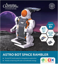 Load image into Gallery viewer, Astro Bot Space Rambler toy with Australian Geographic branding on a space-themed background