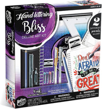 Load image into Gallery viewer, Hand lettering Bliss Deluxe Art Kit packaging with art supplies and text on a colorful background
